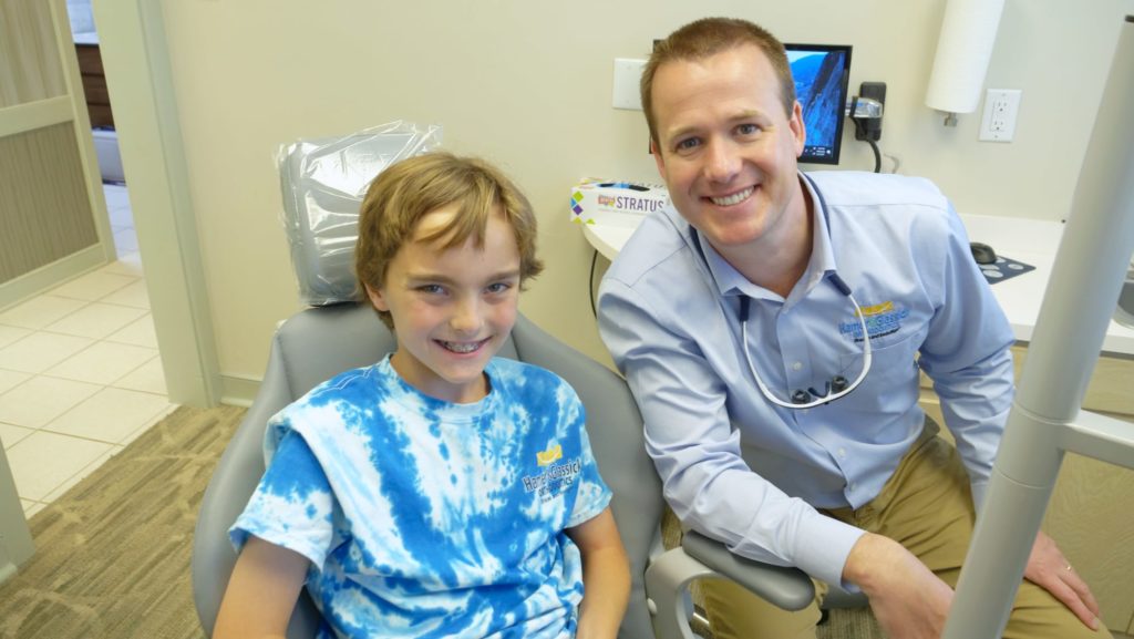 Dr. Glassick smiling with a patient